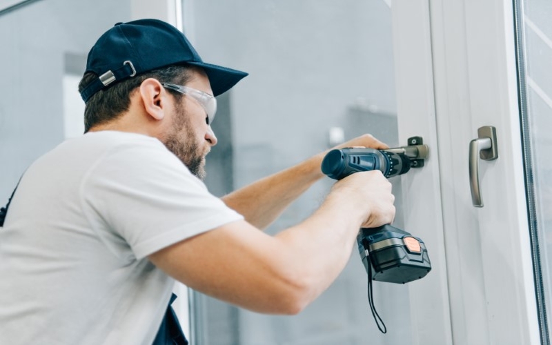 handyman-fixes-the-lock-door-frame